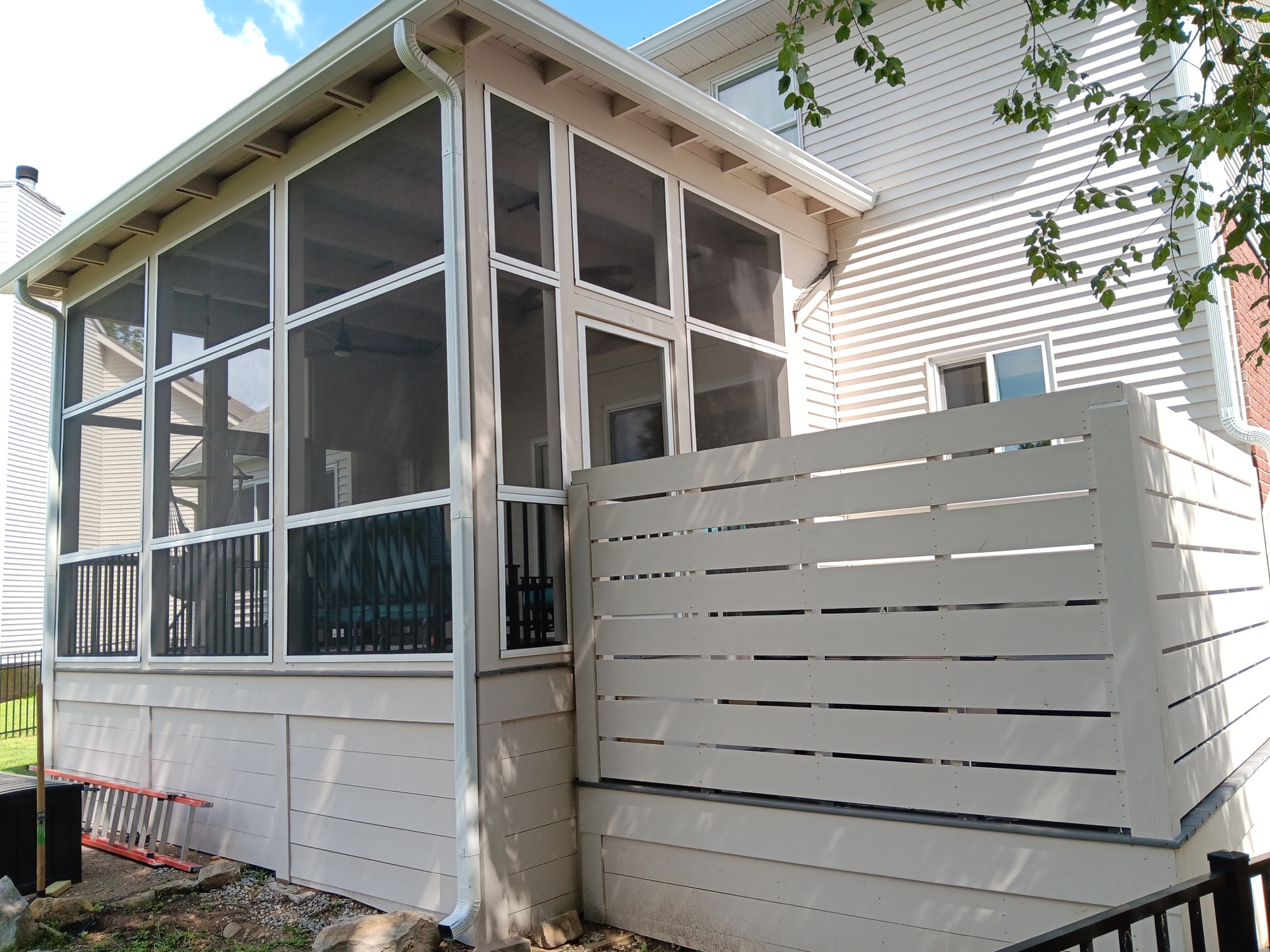 Completed screened porch with a horizontal privacy wall